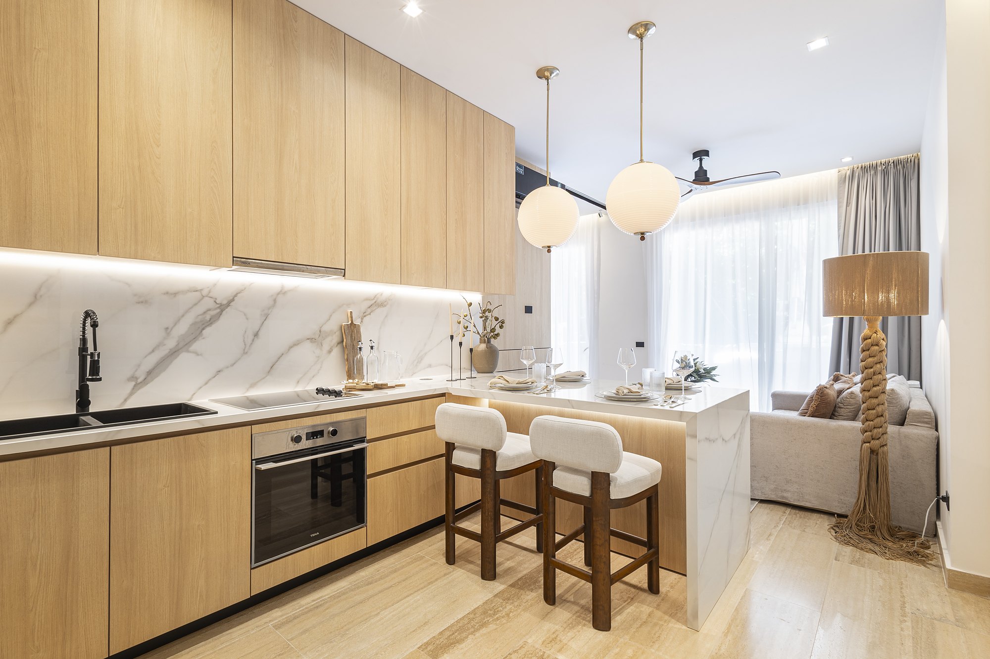 Kitchen and living room of the condo